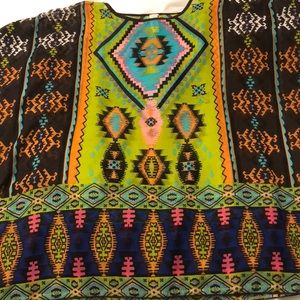 Very cute flowy shirt!! Fits like a large!